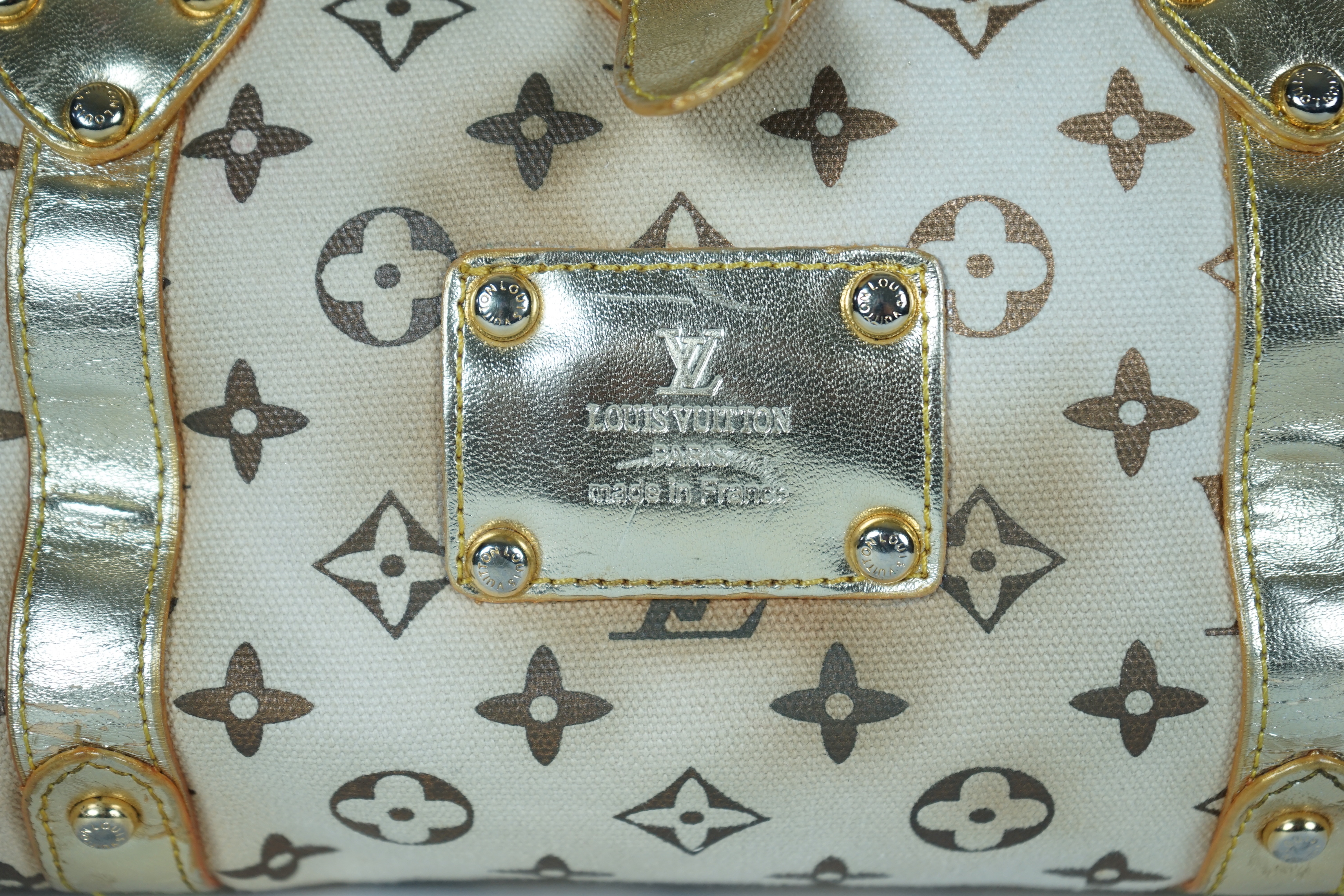 A vintage Louis Vuitton Theda beige and brown Monogram bag